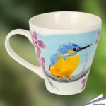 979679110-kaffeetasse-mit-eisvogel-myrte-free